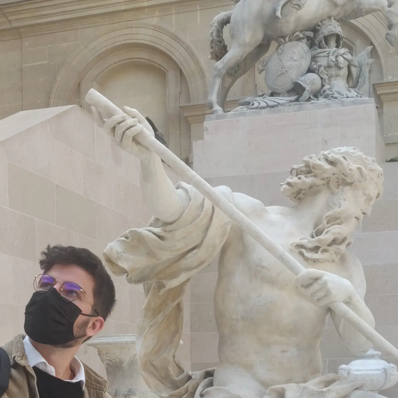 Maxence Raballand in front of a statue